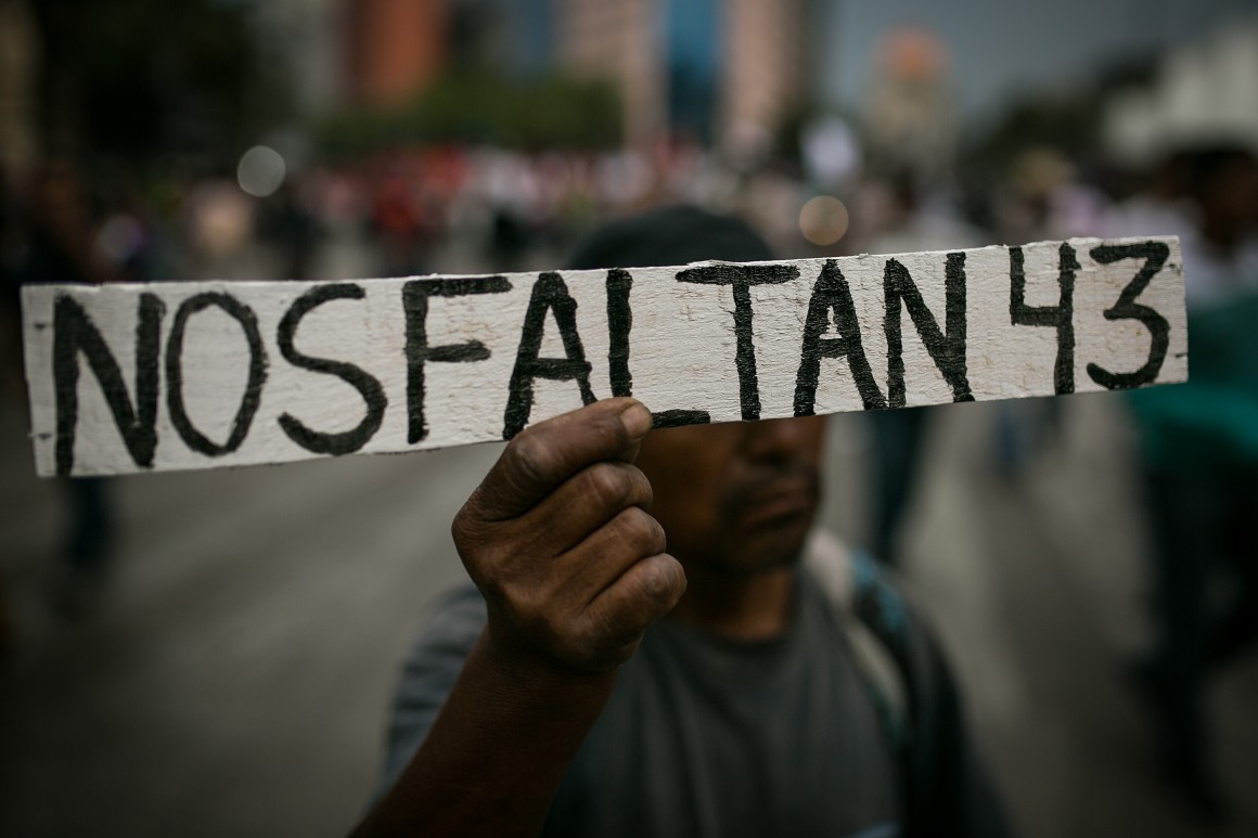 MEXICO CITY, MEXICO - JUNE 26: A man holding a banner is seen during a protest against Mexican Government to demand the safe return of the 43 missing students of Ayotzinapa, kidnapped by local police in the southern Mexican State of Guerrero on June 26, 2015 in Mexico City, Mexico. (Photo by Manuel Velasquez/LatinContent/Getty Images)