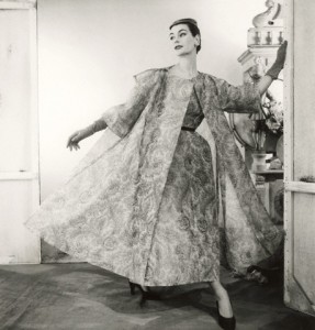 ca. 1954 --- Model wearing paisley silk organdy dress and coat, both by Balenciaga. --- Image by © Condé Nast Archive/CORBIS