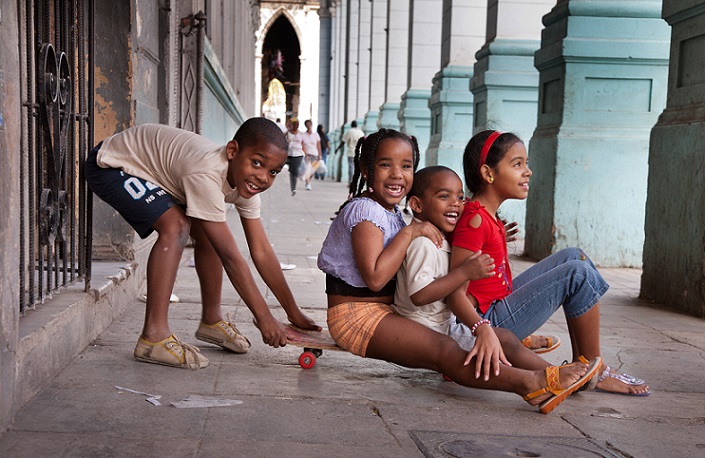 Childrten having fun with a skateboard by the “Recovas”. Havana (La Habana), Cuba