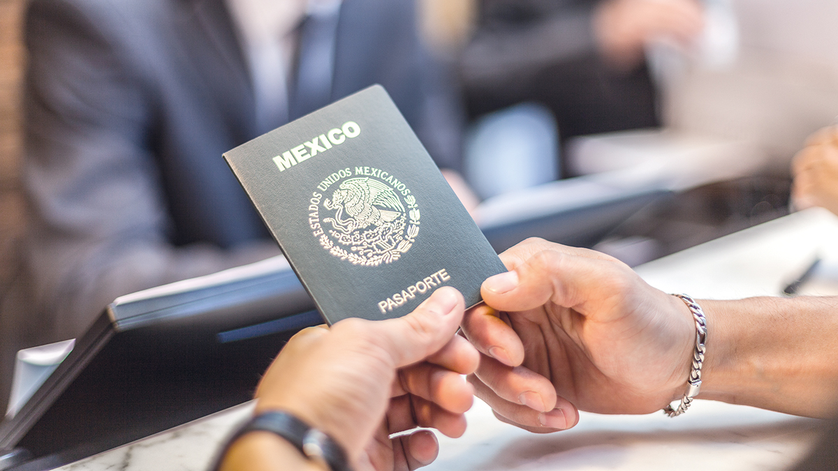 A mexican passport waiting to be taken for a hotel check in