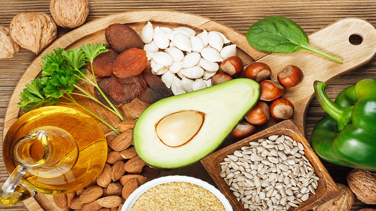 Foods rich in vitamin E such as wheat germ oil, dried wheat germ, dried apricots, hazelnuts, almonds, parsley leaves, avocado, walnuts, pumpkin seeds, sunflower seeds, spinach and green paprika