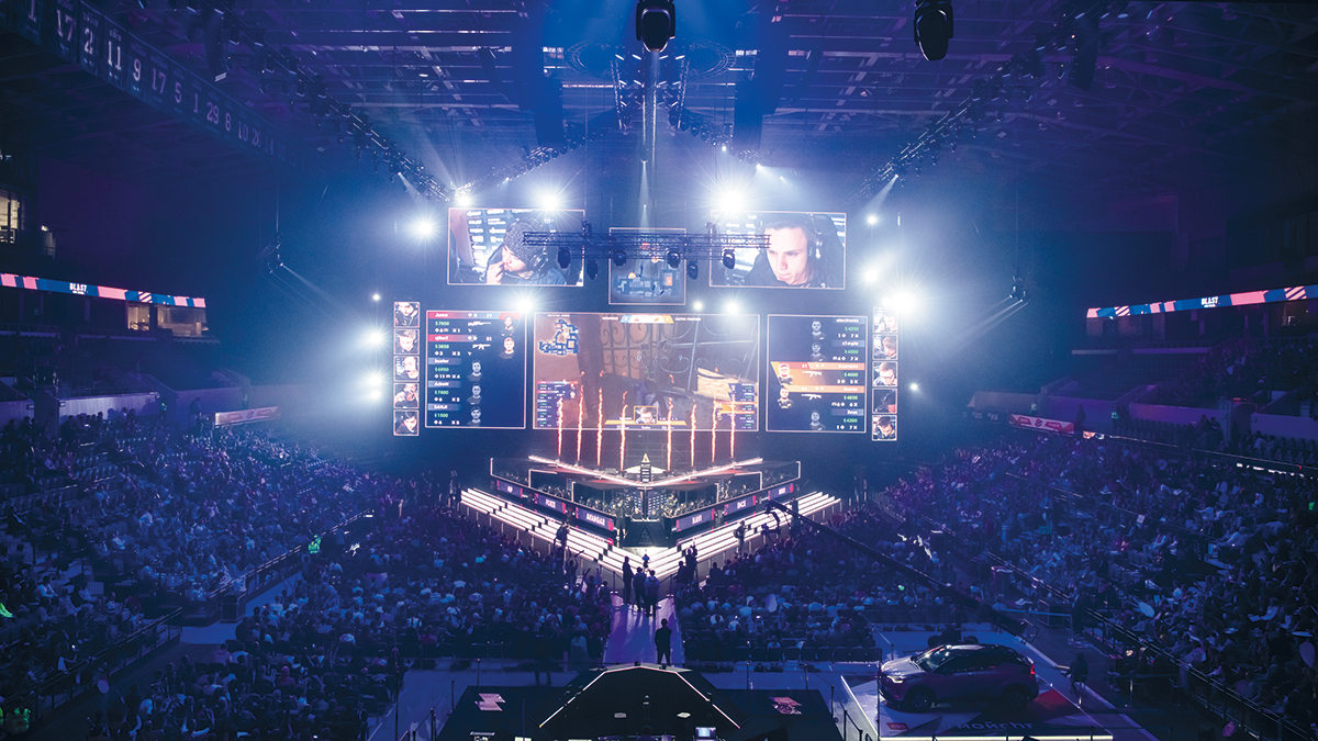 MOSCOW, RUSSIA – 14th SEPTEMBER 2019: esports Counter-Strike: Global Offensive event. Big illuminated main stage of a computer games tournament located on a big stadium. Tribunes are full of video